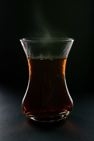 Cup of tea black backgroundの写真素材