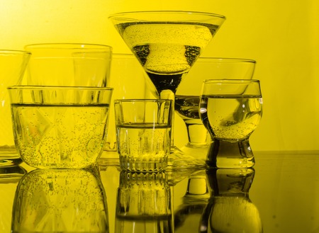 Glass shined with colored light on a light background. A high key.の写真素材