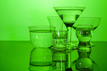 Glass shined with colored light on a light background. A high key.の写真素材