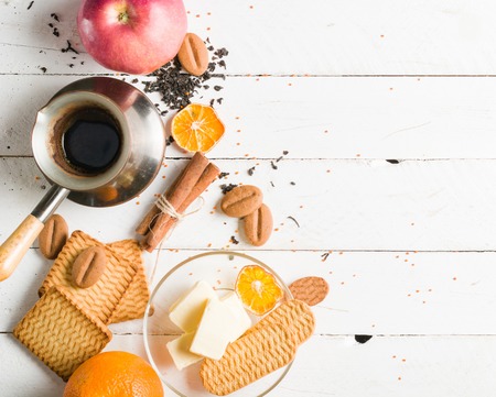 Morning tea with fruit and candied fruit. White wooden background and place for text.の写真素材