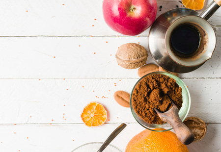 Morning tea with fruit and candied fruit. White wooden background and place for text.の写真素材