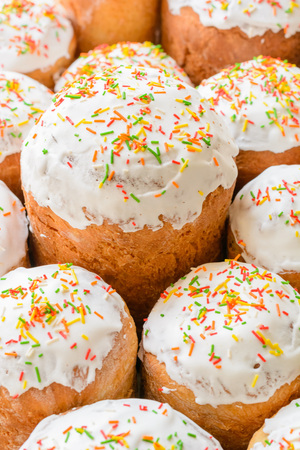 A lot of Easter cakes with sugar icing and colored ornaments.の写真素材