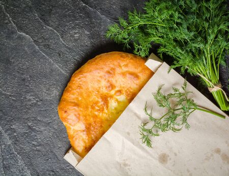 Georgian hot khachapuri bread on a dark background. Place for the text. view from above.の写真素材