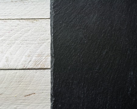 Background slate black on white painted board. View from above. Lots of space for text.の写真素材