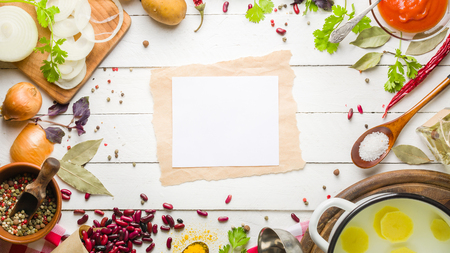 Preparation of soup at home. Rustic white background with vegetables and ingredients around the perimeter.の写真素材