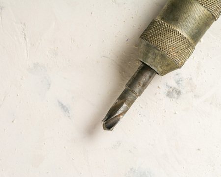 Old hand drill and drill. Sharp cutting edge. Drilling holes.の写真素材
