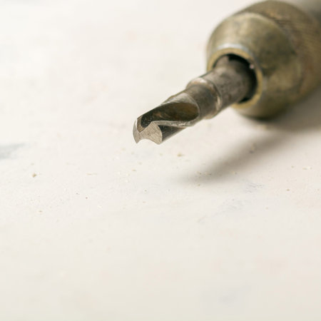 Old hand drill and drill. Sharp cutting edge. Drilling holes. Copy space.