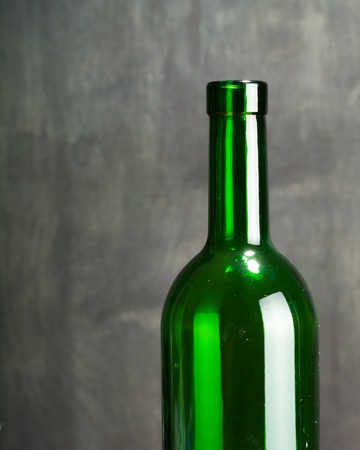 High wine glass made from green glass. No content. Low key.の写真素材