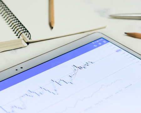 Luminous screen device with charts and quotations of the stock exchange. Finances and stock...