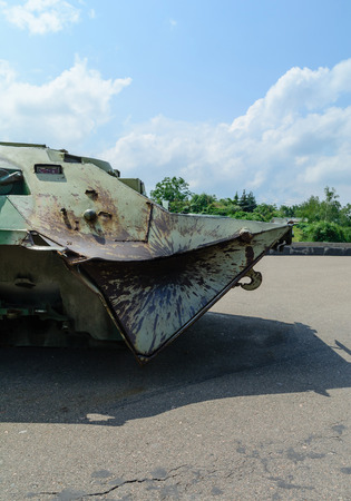 Military conflict and broken military equipment. Hit the projectile in a sheet of armor.の写真素材