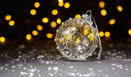 Dark magic background card for Christmas or New Year. Bright blurry lights of a garland. Place for greeting textの写真素材