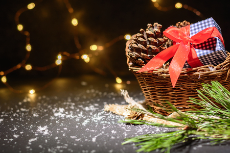 Dark magic background card for Christmas or New Year. Bright blurry lights of a garland. Place for greeting textの写真素材