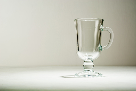 Glass empty glass or cup for mulled wine. Light background. Plenty of room for text. Copy space.の写真素材