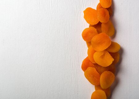 Delicious and healthy dried apricots. Freshly dried. On a white background.の写真素材