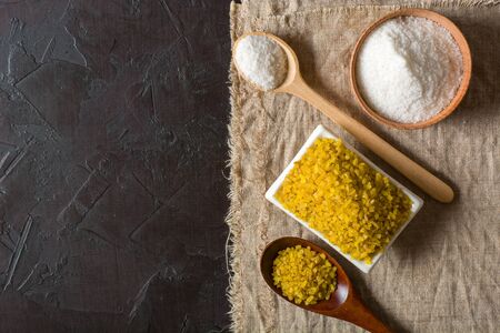 Bulgur on a dark background. wholesome organic food for breakfast or diet. Natural fabrics and earthenware. Copy space.の写真素材