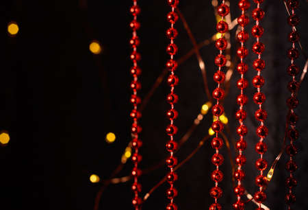 Vertical red Christmas tree garlands. Decoration for Christmas. Ghost lights.の写真素材