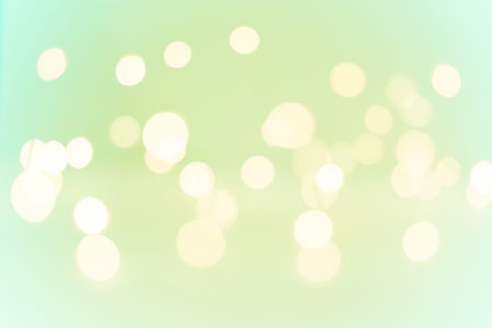 Blurry bright lights of varying sizes and intensities. Lively holiday cover design.