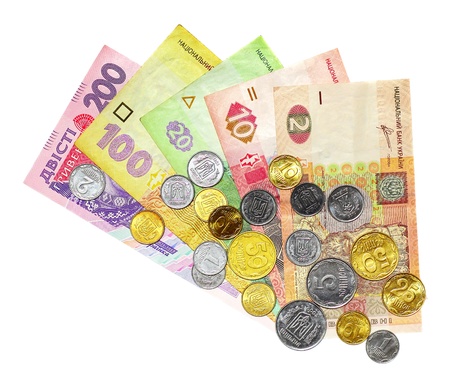 Ukrainian money called hryvnya with coins on top of them isolated on white backgroundの写真素材