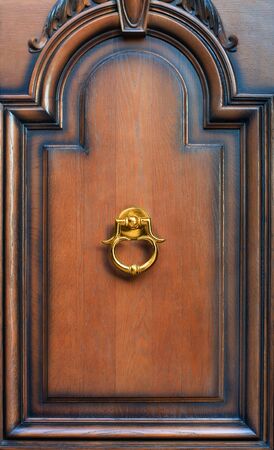 Modern door knock on brown backgroundの写真素材