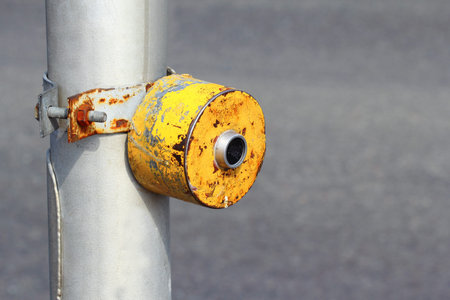 Yellow crosswalk button which enables green light signal