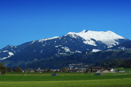 Beautiful Alpine landscape over dramatic blue sky, Swizerland
