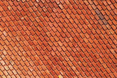 Diagonal rows of red bricks - abstract background