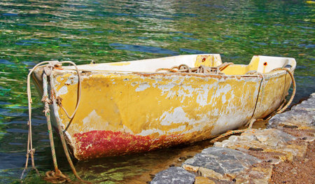 Old abandoned moored rowing boatの写真素材