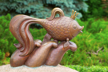 KIEV, UKRAINE - 18 JUNE, 2016: The well known character of the Russian fairy tale - the Golden Fish who made wishes come true. Recently erected statue in Kiev, Ukraineのeditorial素材