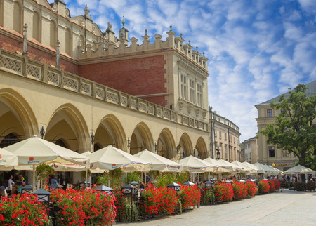 Krakow, Poland - 2 September, 2016: Sukiennice building in Krakow, Poland. People enjoying their meals in local cafe.のeditorial素材