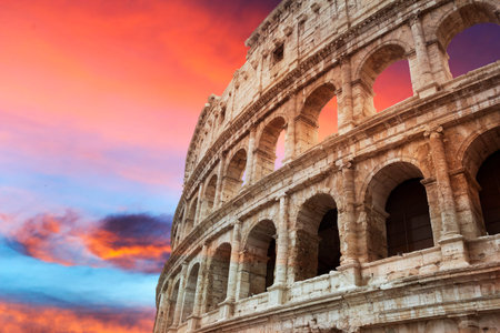 Coliseum fragment at beautiful red sunset, Rome, Italy