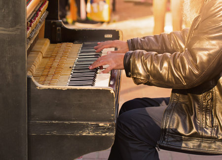 Unidentified person playing the piano on the streetの写真素材