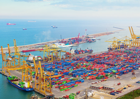 Barcelona, Spain - 26 March, 2017: View from Montjuic mountain on port of Barcelona. The port is full of cargo and cargo cranes.のeditorial素材