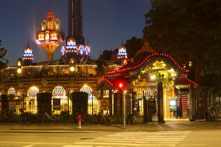 Copenhagen, Denmark - 24 September, 2017:  Entrance gate to Tivoli amusement park at evening, Copenhagen, Denmark. Tivoli is a very popular entertainmet place gathering crowds of people.のeditorial素材