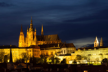 Night view of Prague in lights: ancient historic buildings and St. Vitus Cathedral, Czech Republicの写真素材