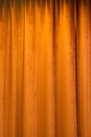 Terra cotta colored curtain indoors, abstract backgroundの写真素材