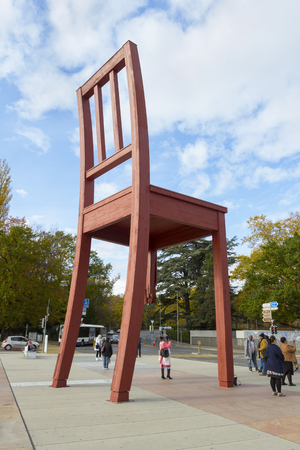 Geneva, Switzerland - October 29, 2017: People visiting the broken chair monument at the Square of Nations in sunny day.のeditorial素材