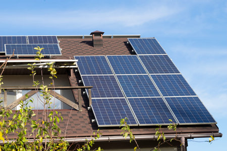 Roof of a countryside building covered with solar panels supplying with cheap electricity