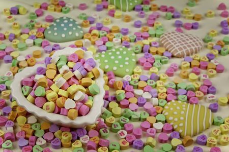 Valentines Conversation Hearts and Decorated Heart Cookiesの写真素材