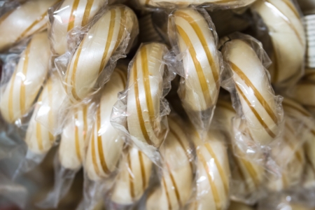 Butterscotch candy canes on displayの写真素材