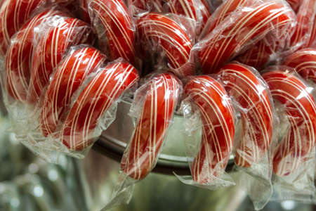 Red candy canes in silver displayの写真素材