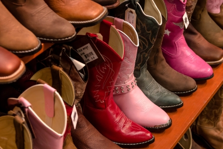 Display of kids cowboy boots on shelfの写真素材