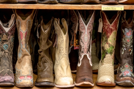 Collection of brightly colored womens cowboy bootsの写真素材