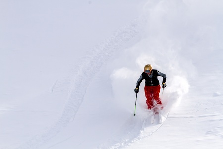 Male skier in fresh powder at Ski Days during 50 Year Steamboat Springs winter celebrationのeditorial素材