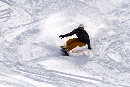 Male snowboarder in fresh powder at Ski Days during 50 Year Steamboat Springs winter celebrationのeditorial素材