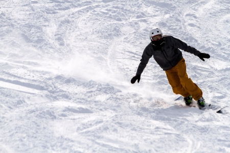 Male snowboarder in fresh snow at Ski Days during 50 Year Steamboat Springs winter celebrationのeditorial素材