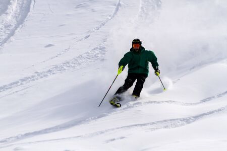 Male skier on fresh powder at Ski Days during 50 Year Steamboat Springs winter celebrationのeditorial素材