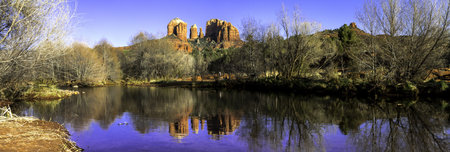 Panorama of evening sunset at Cathedral Rock at Red Rocks Crossing on Oak Creek in Sedona Arizonaの写真素材