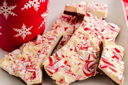 Close up of traditional holiday chocolate peppermint bark candy on white plateの写真素材