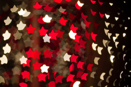 Abstract heart shaped bokeh of red and white Christmas lightsの写真素材