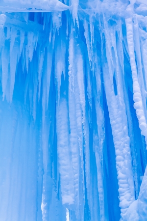 Abstract ice and icicles formations hanging on cold winter dayの写真素材